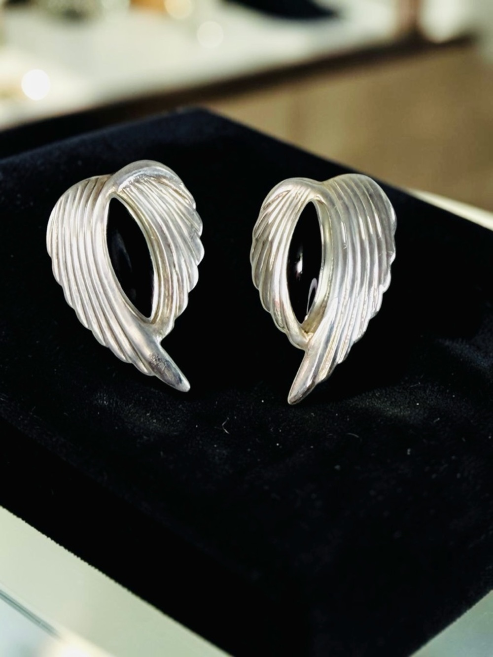 Silver Wing-Shaped Clip Earrings - Sculpted Feather Design